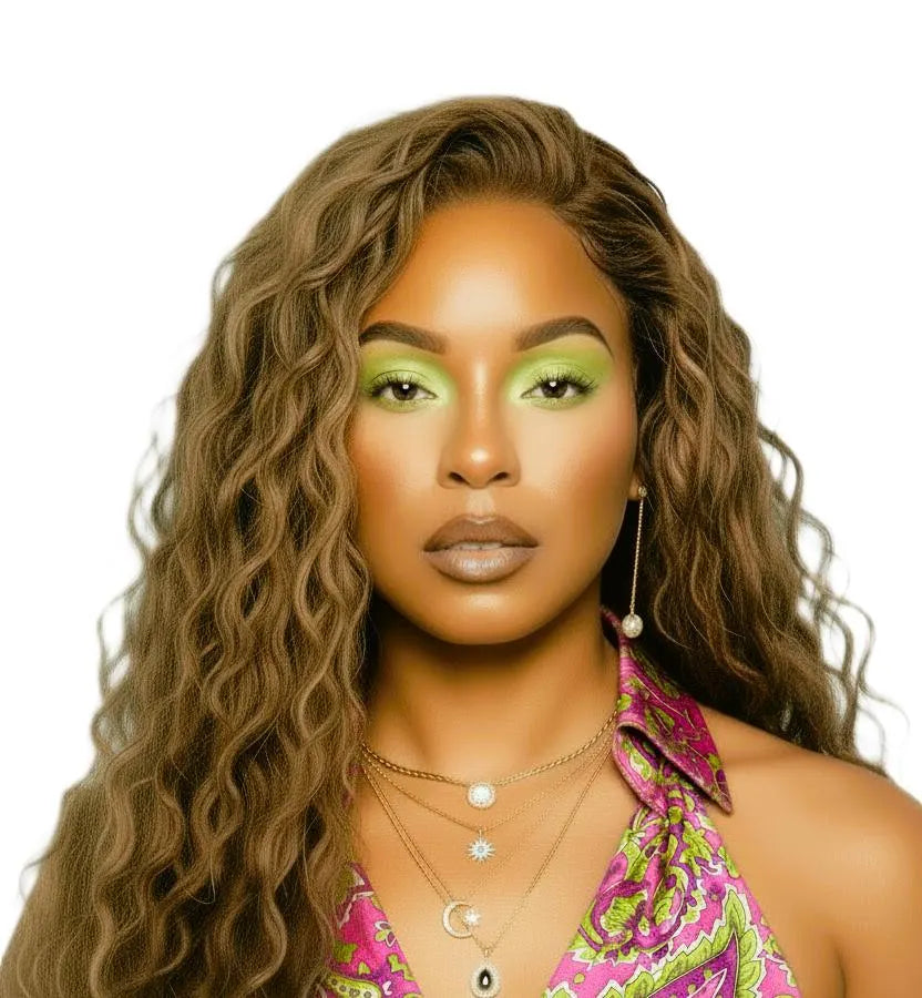 Woman with long wavy light brown hair wig wearing a colorful top on a white background